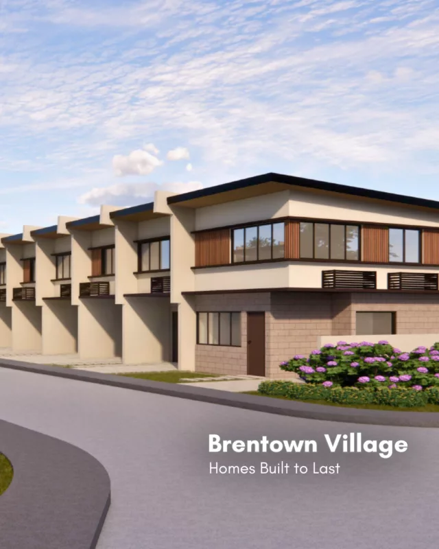 Filipino-style modern homes at Brentown Village in Biñan, featuring adobe stone accents, a quiet suburban street, and lush greenery—an upcoming residential community near Biñan City Hall and Brent International School.