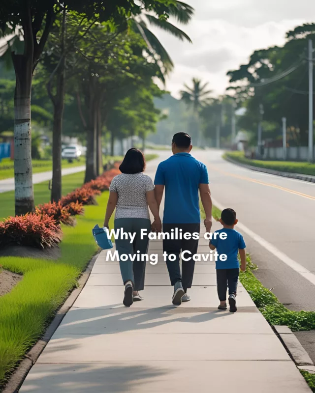 A young Filipino family walking together along a tree-lined street in a quiet residential community in Cavite, with greenery in the background.